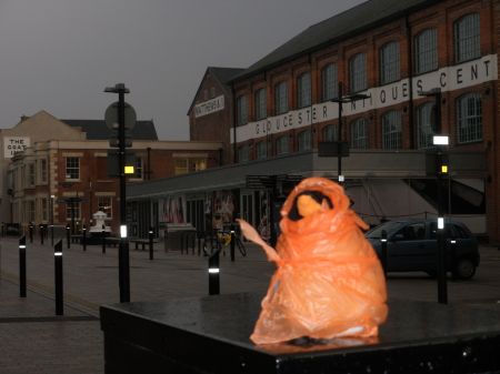 penguin in front of antiques center