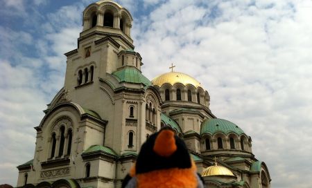 penguin in front of alexander nevsky cathedral
