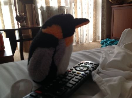 penguin with tv remote