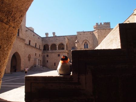 penguin sitting on the stairs