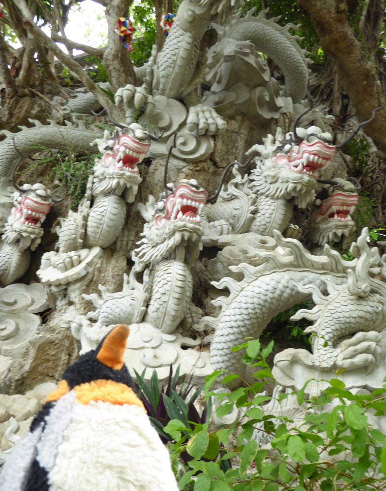 penguin in front of dragons