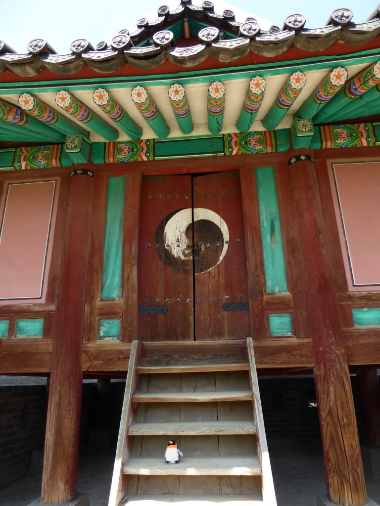 penguin sitting on steps