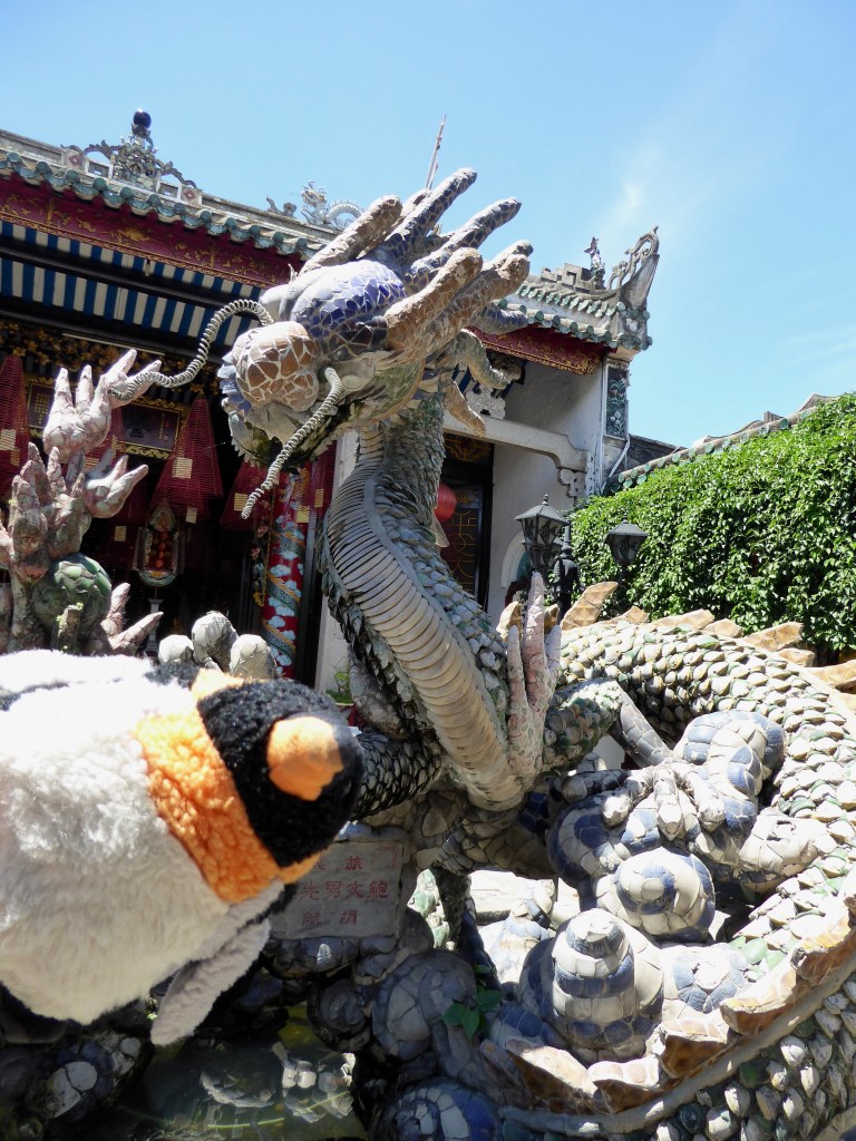 penguin grabbed by dragon